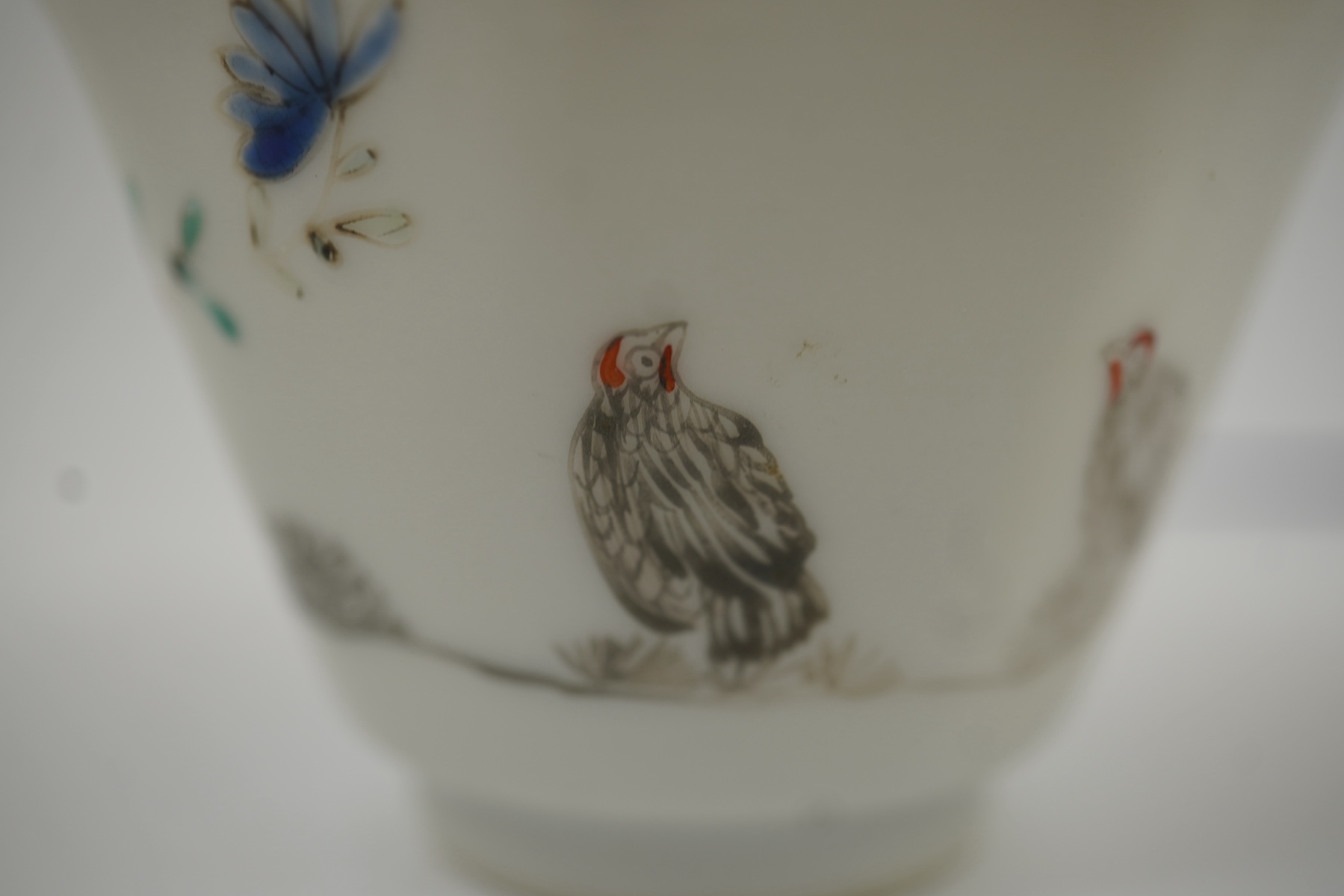 Two Chinese semi-eggshell porcelain hexagonal saucers and a similar cup, Yongzheng/Qianlong period